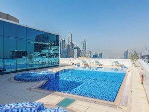 Outdoor pool -  Stylish Studio Escape in the Heart of JLT (Dubai)