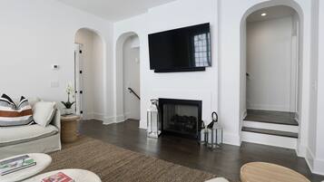 Smart TV, fireplace, books