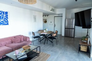 Apartment, 3 Bedrooms, Beach View, Sea Facing | Living area | TV