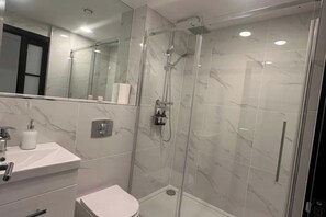 Shower, towels, soap, shampoo