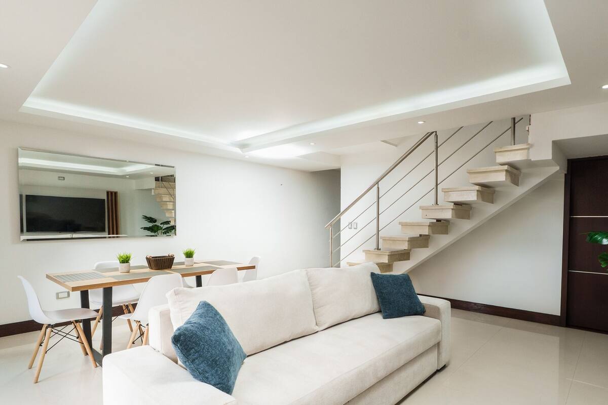 Deluxe Apartment, City View | Living area | 32-inch flat-screen TV with digital channels