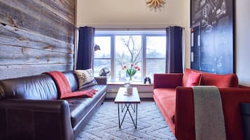 The Swan Suite | Living area | 54-inch Smart TV with digital channels, Netflix, streaming services
