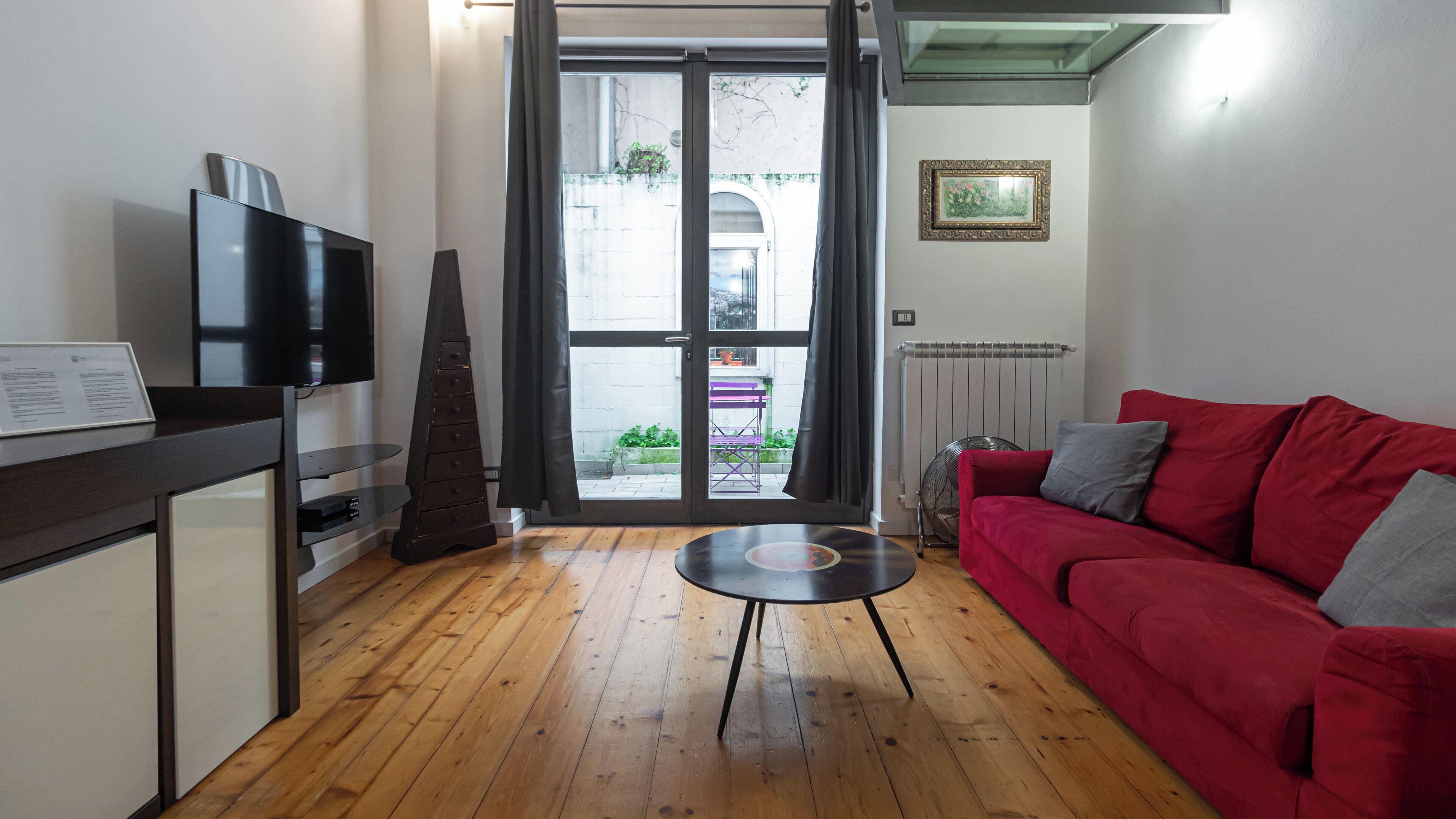 Apartment (1 Bedroom) | Living area | 32-inch Smart TV with cable channels