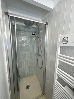 Shower, hair dryer, towels, soap