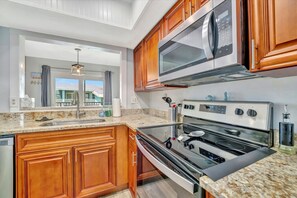 Fridge, microwave, oven, stovetop - 1 Bedroom Condo Steps from Shops, Beach, and More (Bradenton Beach)