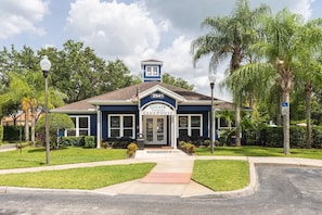 A building with a sign reading "2941 Lucaya Village Clubhouse".