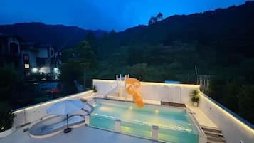 Relax by the pool with a breathtaking view of the surrounding landscape.