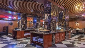 A checkered floor, wooden ceiling, and a bar area with marble countertops. - Bremen Hotel ( Central Street) (Harbin)