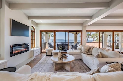 NEW Waterfront 6 bedroom home with large pool and luxurious outdoor living area!