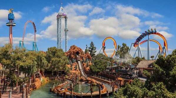 A theme park with roller coasters, a tall tower, and a water ride. - Chic New York Style 10 Minutes to SNA Disneyland (Santa Ana)
