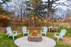 Unwind by the fire pit under the stars (bring your own wood) and savor al fresco dining for 6. A perfect outdoor escape—just note, rain may cause temporary flooding. - Emerald Lakes | Theater, Game Room, Firepit (Long Pond)