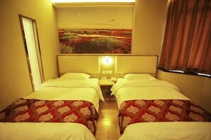 A hotel room with two single beds, a large painting on the wall, and a window with curtains. - Super 8 Hotel (Beijing Tian'anmen Wangfujing Pedestrian Street) (Beijing)