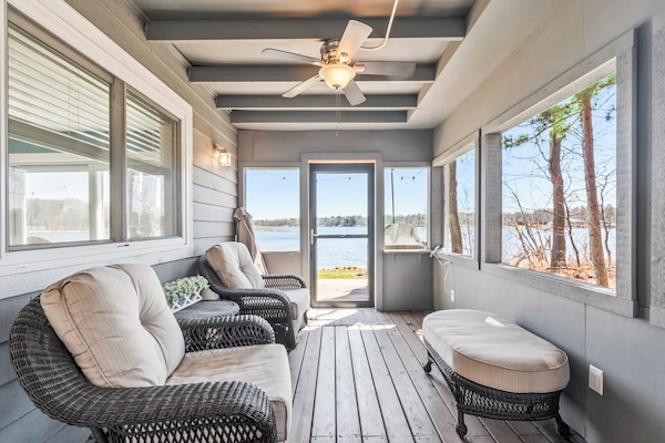 Screened-in porch with comfy seating perfect for watching the stars.