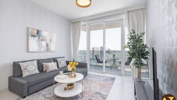 Luxury Apartment, City View | Living area | 55-inch Smart TV with cable channels