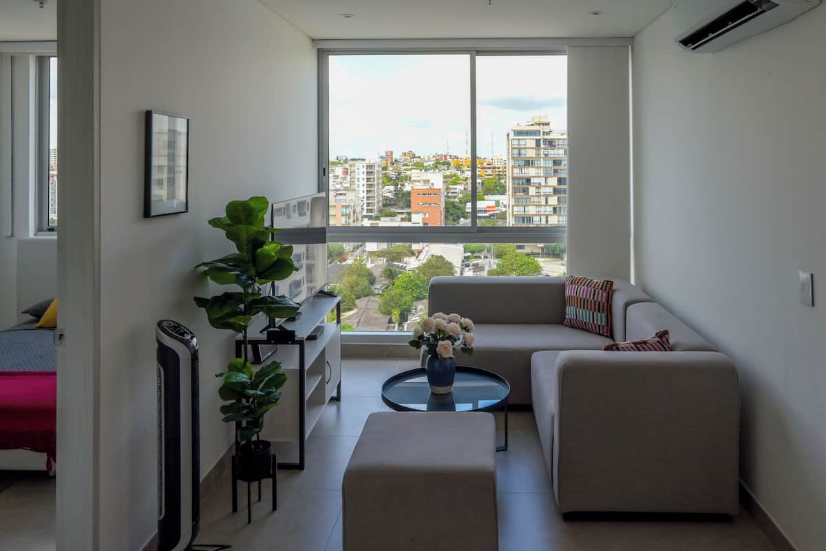 Design Apartment | Living area | 50-inch LED TV with cable channels
