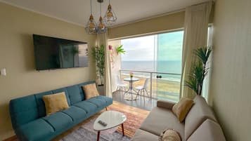 Family Apartment, Beach View | Living area | Flat-screen TV