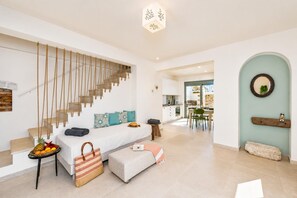 A modern interior with a staircase, a dining area, and a kitchen. - Villa Erofili - Three Bedroom Villa, Sleeps 6 (Agia Triada)