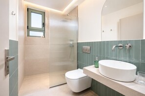 A bathroom with a toilet, a sink, a shower, and a mirror. - Villa Erofili - Three Bedroom Villa, Sleeps 6 (Agia Triada)