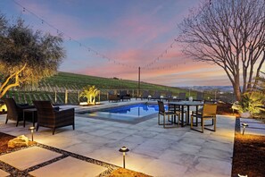 An outdoor patio with a pool, seating area, and string lights. - Wine Country Estate w/ Pool, Hot Tub The Residence at Truss Wines by Avantstay (Paso Robles)