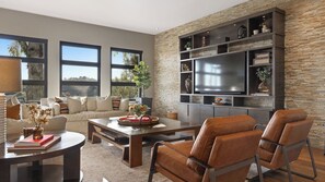 A modern living room with a large flat-screen TV, a sofa, a coffee table, and a fireplace. - Wine Country Estate w/ Pool, Hot Tub The Residence at Truss Wines by Avantstay (Paso Robles)