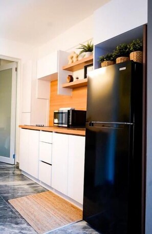Fridge, microwave, stovetop, coffee/tea maker