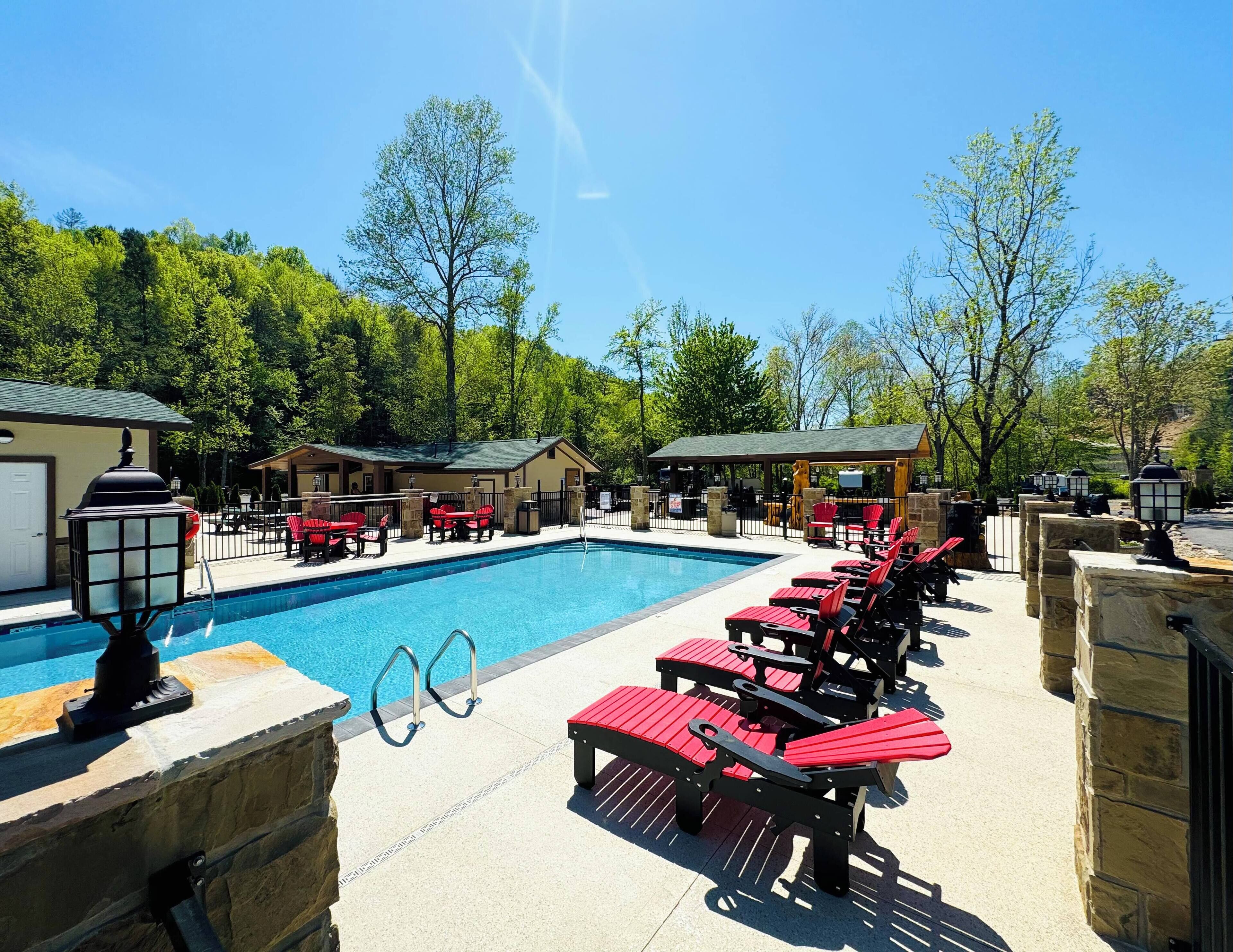 Seasonal outdoor pool, open 9:00 AM to 8:00 PM, pool umbrellas