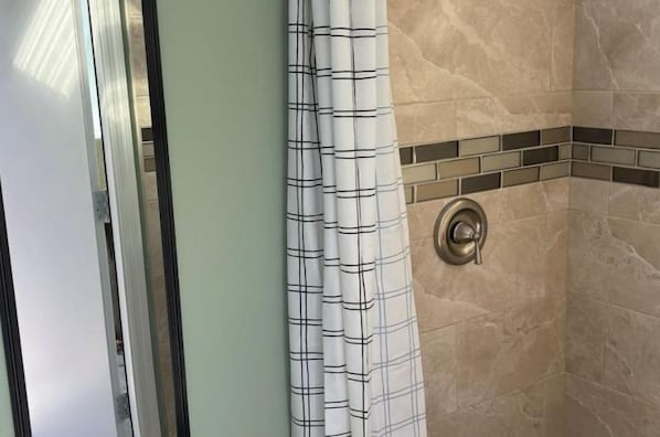 Shower, hair dryer, towels, soap