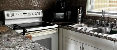 Fridge, microwave, stovetop, coffee/tea maker
