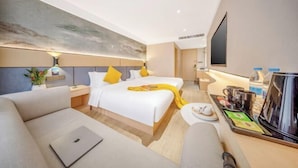 A hotel room with a bed, a sofa, a coffee station, and a TV. - Yimi Collection Hotel (Shanghai Xizang North Road Subway Station) (Shanghai)