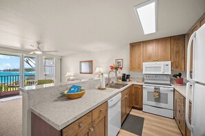 Microwave, stovetop, coffee/tea maker, dining tables