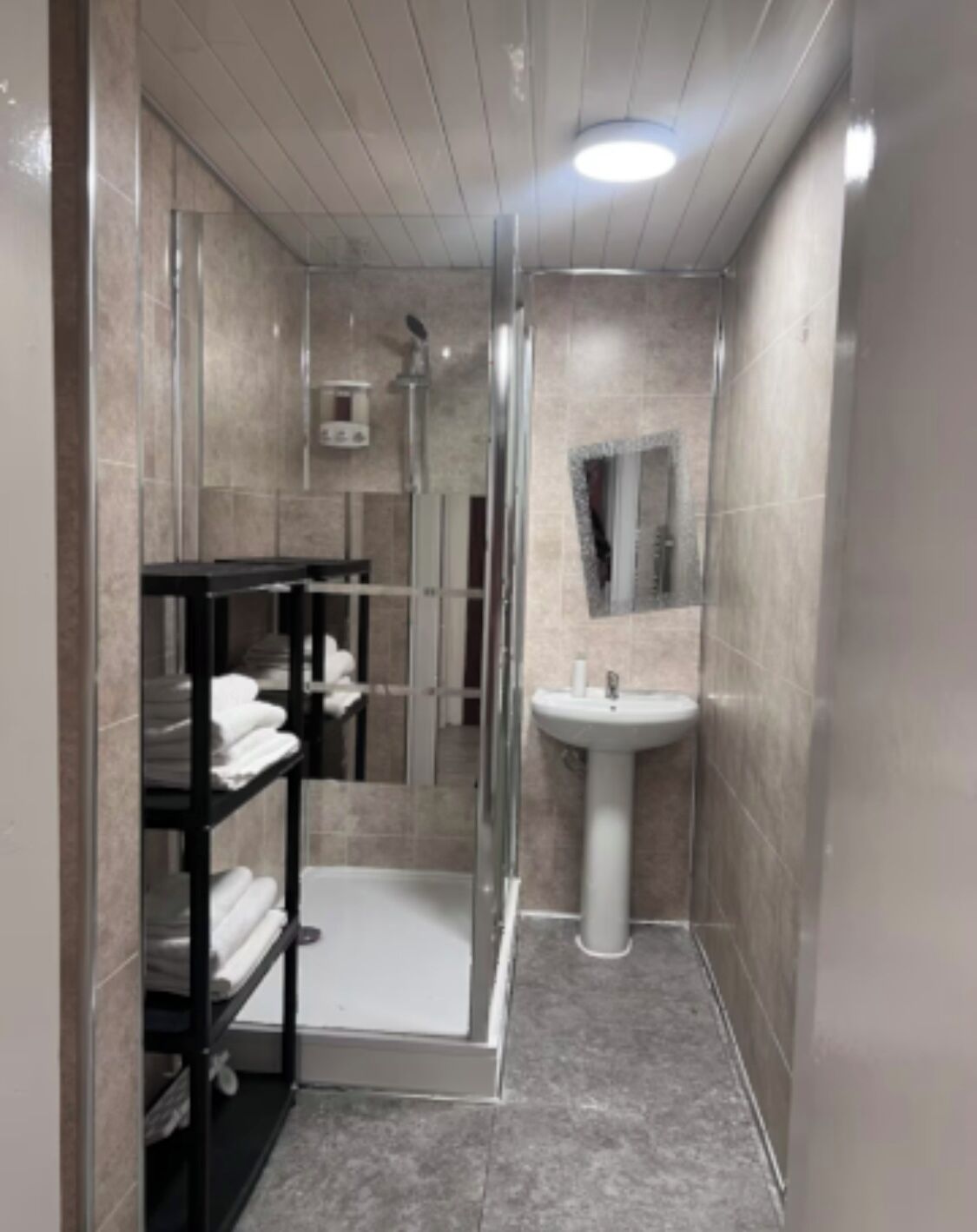 Shower, towels, soap, toilet paper