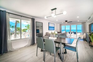 Luxury Condo, 3 Bedrooms, Beachfront | Dining room - Cayman Luxury Rentals at Sunset Cove (Seven Mile Beach)