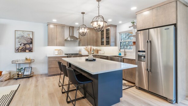 A modern kitchen with a central island, stainless steel appliances, and pendant lighting. - Clear Lake Escape - Lake Views, Pool Table, Ping Pong Table, Fire Pit (Clear Lake)