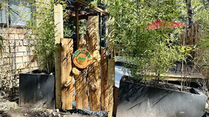 A wooden structure with a sign that reads "Forest Bay." - Island paradise with private hot tub -- pet friendly & breakfast included! (Pender Island)
