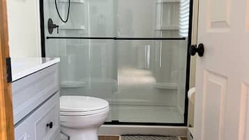 Shower, towels, toilet paper