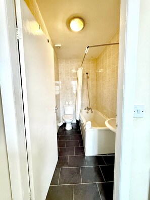 Hair dryer, towels, shampoo, toilet paper