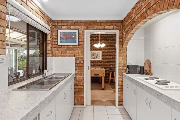 Dishwasher, coffee/tea maker, high chair, cookware/dishes/utensils