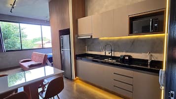 Design Apartment | Private kitchen | Fridge, microwave, stovetop, cookware/dishes/utensils