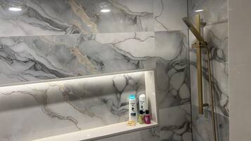 Shower, hair dryer, towels, soap