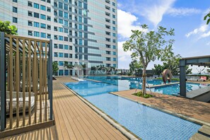 Enjoy a refreshing swim in our rooftop pool surrounded by a deck.