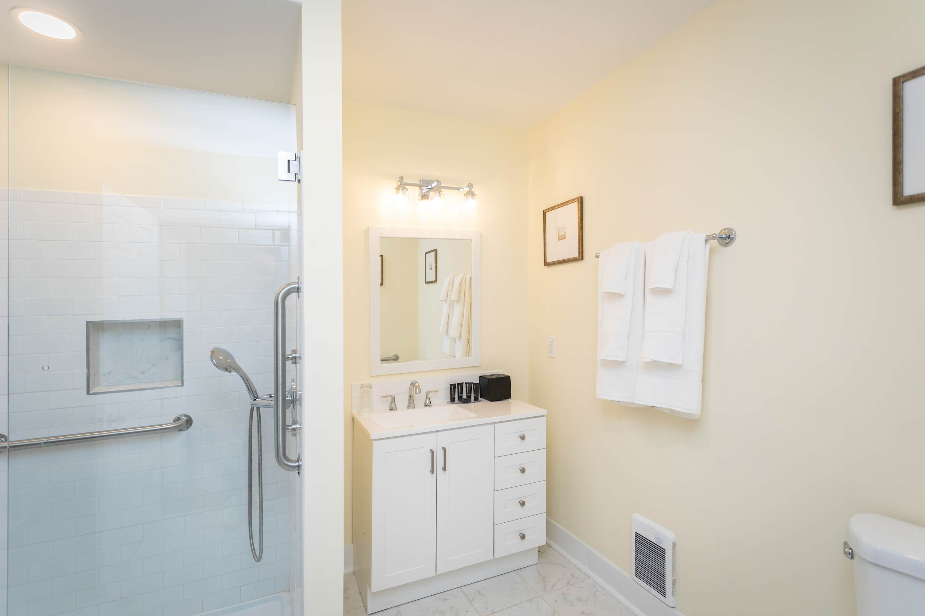Shower, hair dryer, towels, shampoo