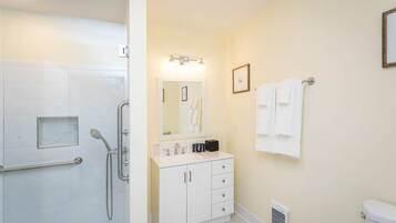 Shower, hair dryer, towels, shampoo