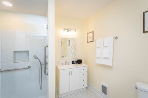 Shower, hair dryer, towels, shampoo