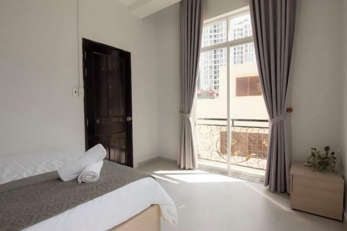 Premium bedding, desk, laptop workspace, soundproofing