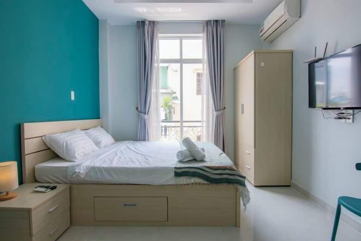 Premium bedding, desk, laptop workspace, soundproofing