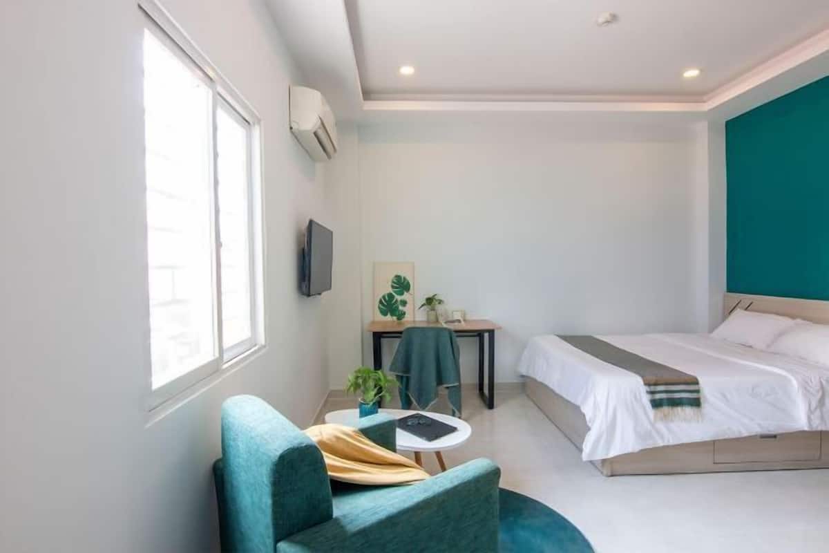 Premium bedding, desk, laptop workspace, soundproofing