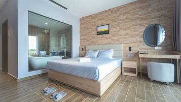 Grand Deluxe River View | Premium bedding, minibar, desk, laptop workspace