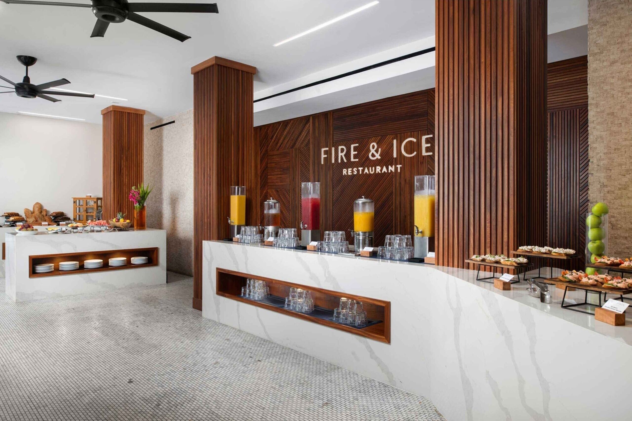 A buffet area with a wooden wall and a sign that reads "Fire & Ice Restaurant."