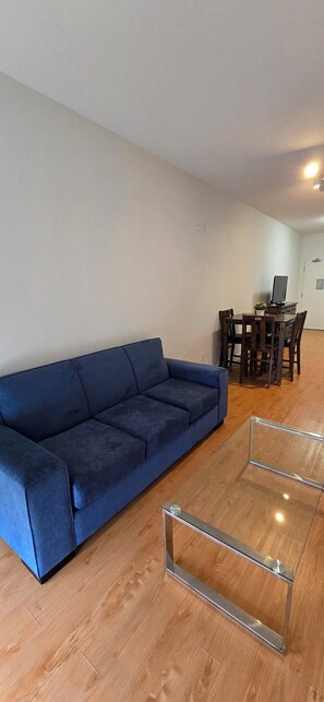 Family Quadruple Room | Living area | 43-inch Smart TV with digital channels - NEW ROYAL INN (New Westminster)