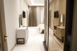 Luxury Suite, 1 King Bed, Garden View | Premium bedding, laptop workspace, blackout drapes, iron/ironing board